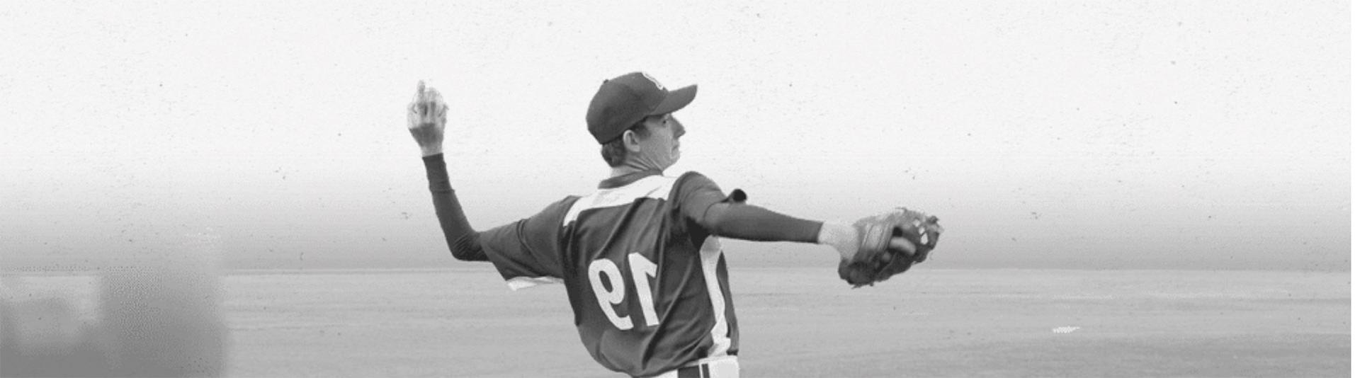 Monochrome image of pitcher throwing ball